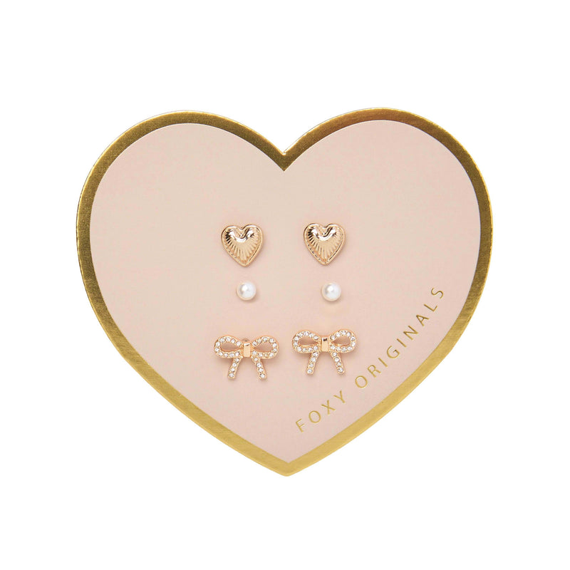 Bella Mix & Match Earrings by Foxy Originals – gold heart, pearl, and pavé bow studs displayed on heart-shaped card packaging