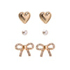 Bella Mix & Match Earrings set in gold – three pairs including heart, pearl, and pavé bow studs by Foxy Originals