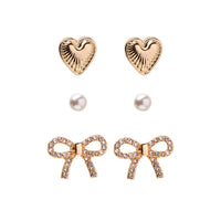Bella Mix & Match Earrings set in gold – three pairs including heart, pearl, and pavé bow studs by Foxy Originals
