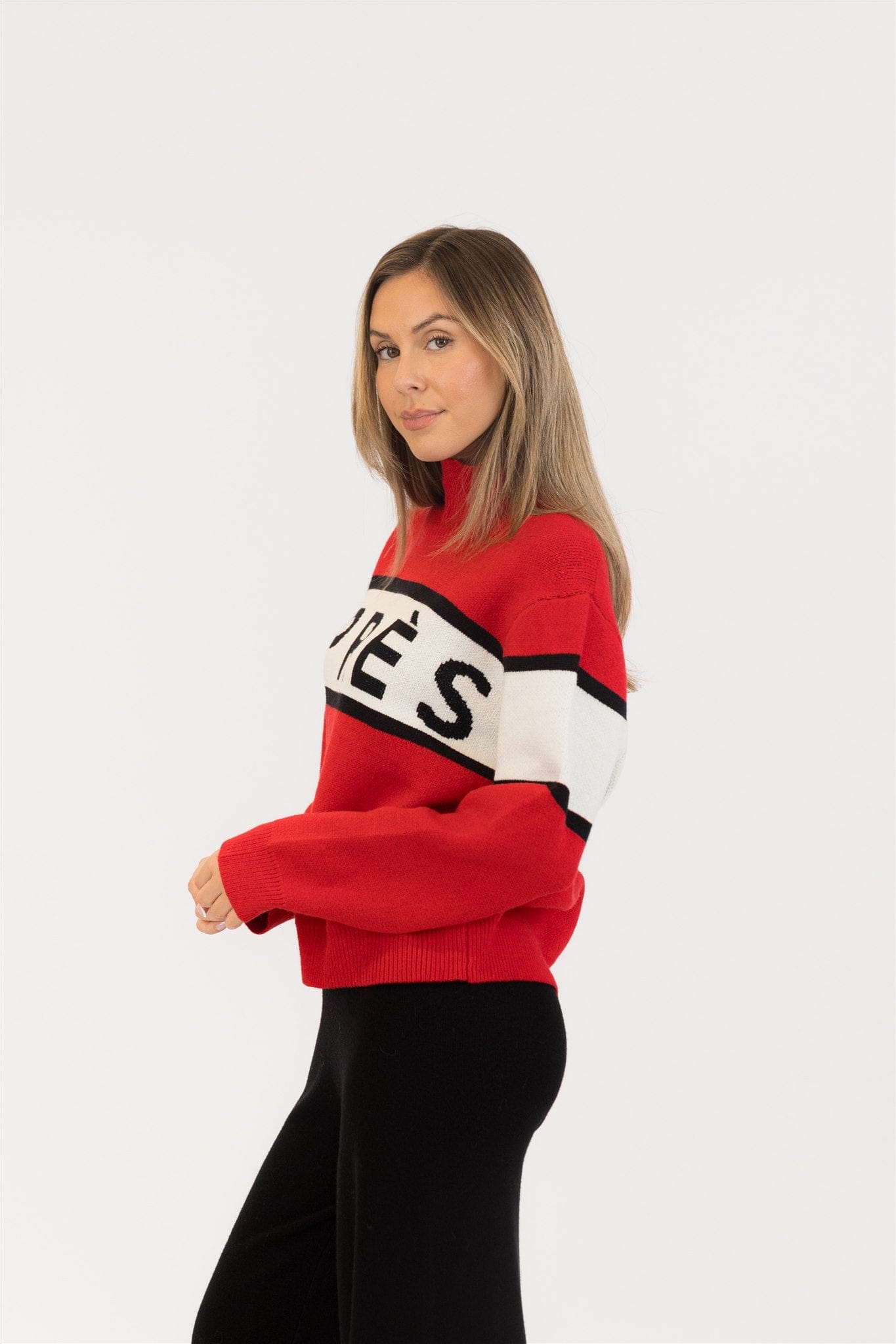 Woman wearing a red sweater with text on a white background