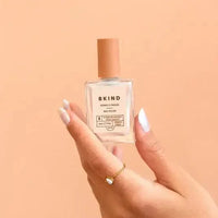 Model holding Bkind's Perle colour nail polish.
