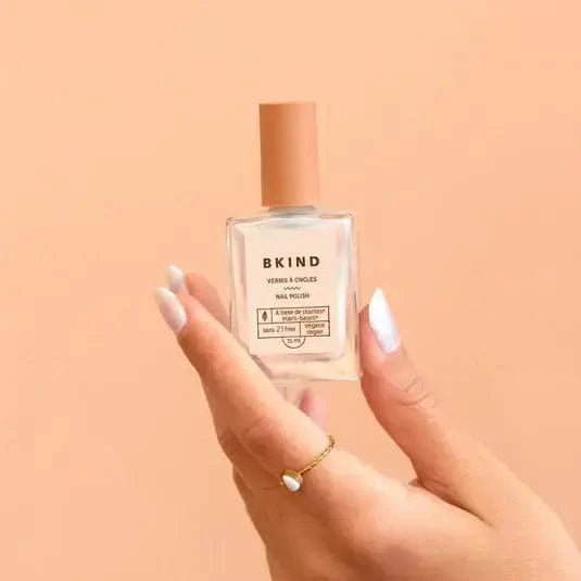 Model holding Bkind's Perle colour nail polish.
