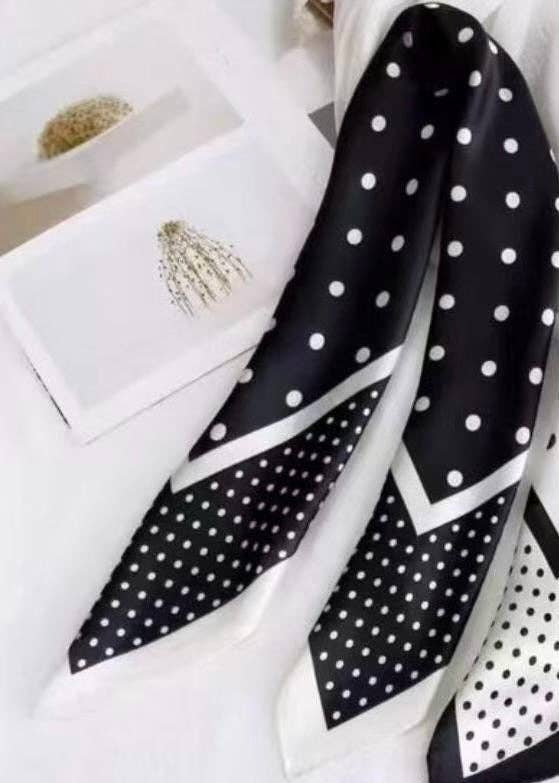 Black and white polka dot scarf flat-lay view Lemonberry Aurora