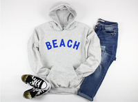 Blonde Ambition Beach Graphic Hoodie flat lay with denim Lemonberry Aurora