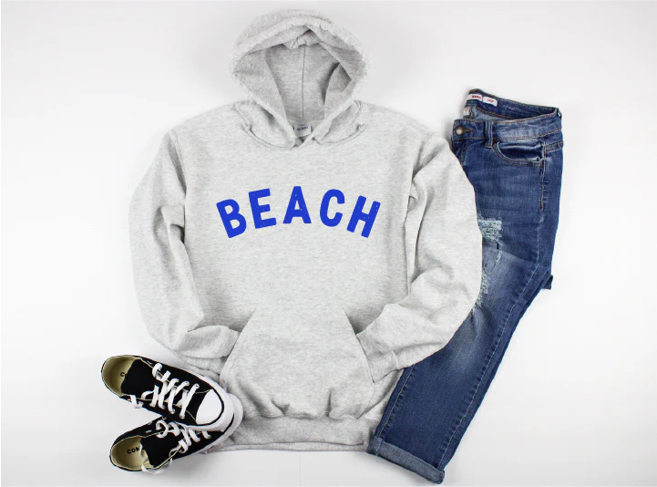 Blonde Ambition Beach Graphic Hoodie flat lay with denim Lemonberry Aurora