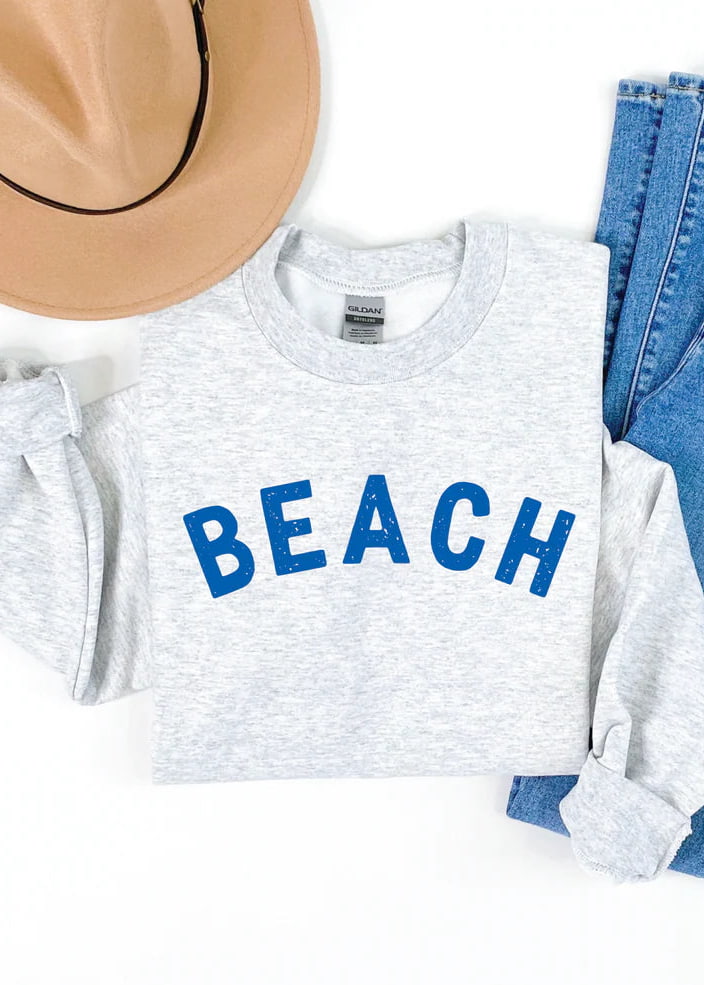 Blonde Ambition Beach Classic Crew Neck Sweater in grey flat lay with jeans and hat