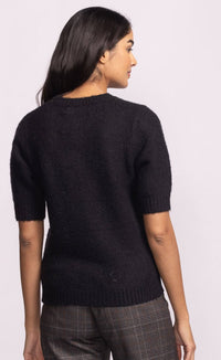 Back view of Pink Martini Bonjour Sweater in black with red “Bonjour” lettering – available at Lemonberry, Aurora boutique.