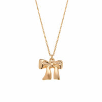 gold bow pendant on chain against white background, lemonberry aurora