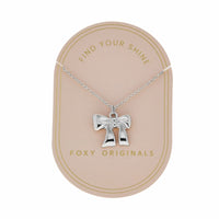 foxy originals silver bow necklace on display card, lemonberry aurora