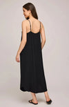 A model wearing the Brooke Dress by Gentle Fawn, showing the back side displaying the cute straps and effortless drape.