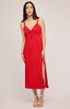 The stunning Cairo dress in brilliant red, paired with strappy sandals.