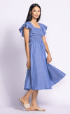 Side angle view of the Camille Dress, highlighting the linen pinstripes, butterfly sleeves, and breezy A-line shape.