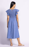 Back view of model wearing the Camille Dress, showing the open back and flowy A-line silhouette.