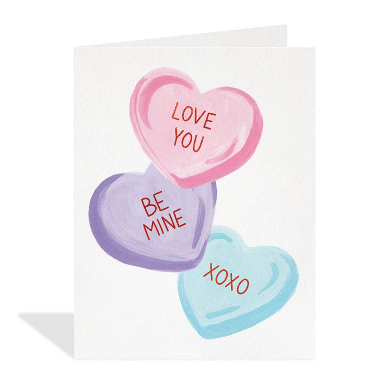 Candy Hearts Love Card illustrated by Paige & Willow, featuring red foil details. Printed on responsibly sourced paper with eco-friendly inks, packaged in a plastic-free format.