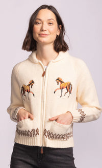 Close-up of Capella Sweater zip front with leather pull and pockets