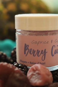Caprice & Co Berry Cute lip scrub jar with lid beside fresh fruit