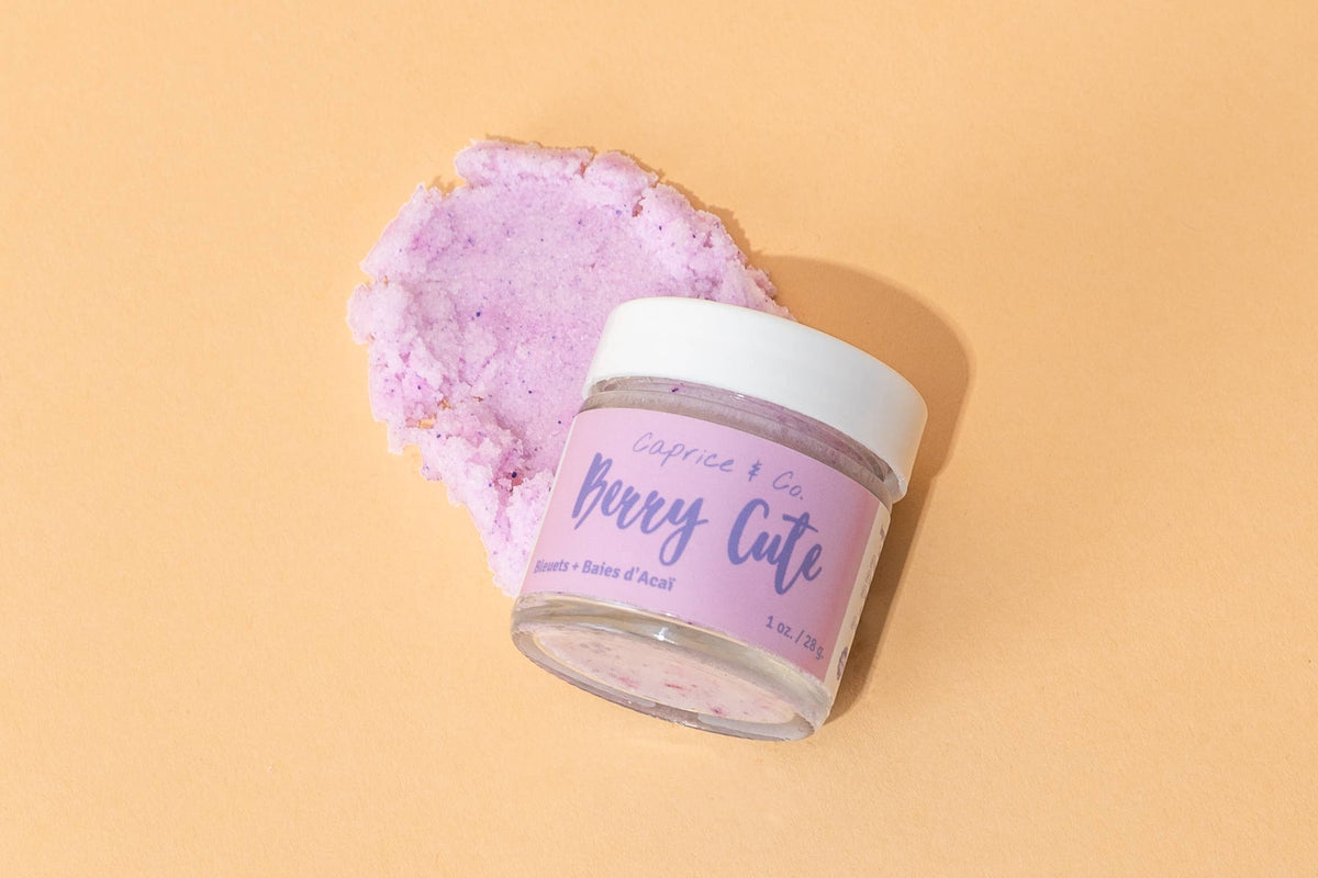 Caprice & Co Berry Cute sugar lip scrub styled on soft pastel surface