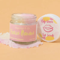 Open jar of Caprice & Co Strawberry Banana lip scrub showing sugar exfoliating texture