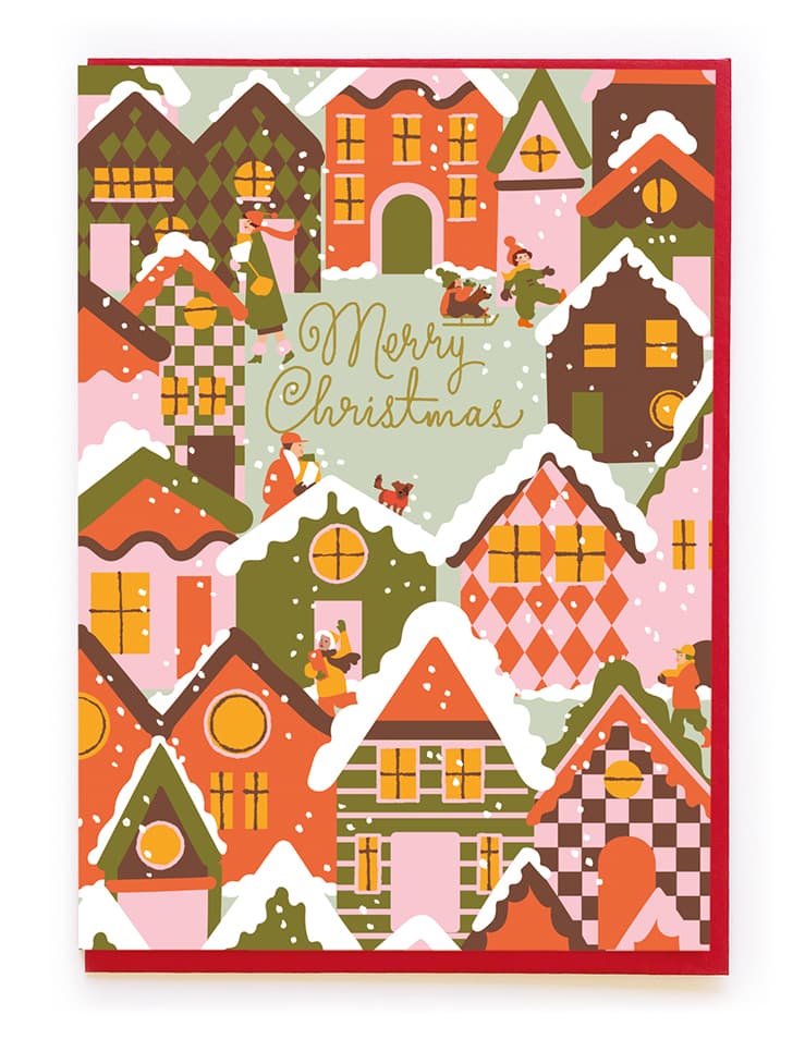 Illustrated snowy Christmas village card with cozy houses and people playing in snow — Lemonberry Aurora flat lay