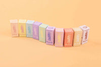 Row of CHUBBY lip balm flavours against pastel background