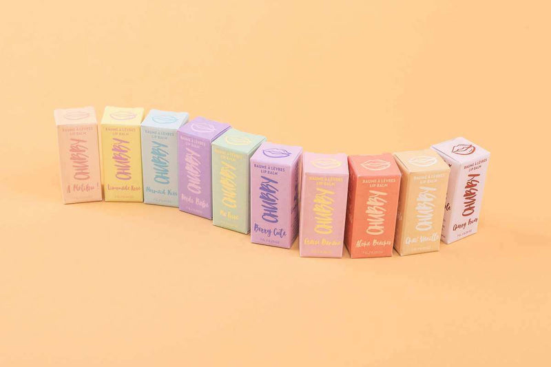 Row of CHUBBY lip balm flavours against pastel background