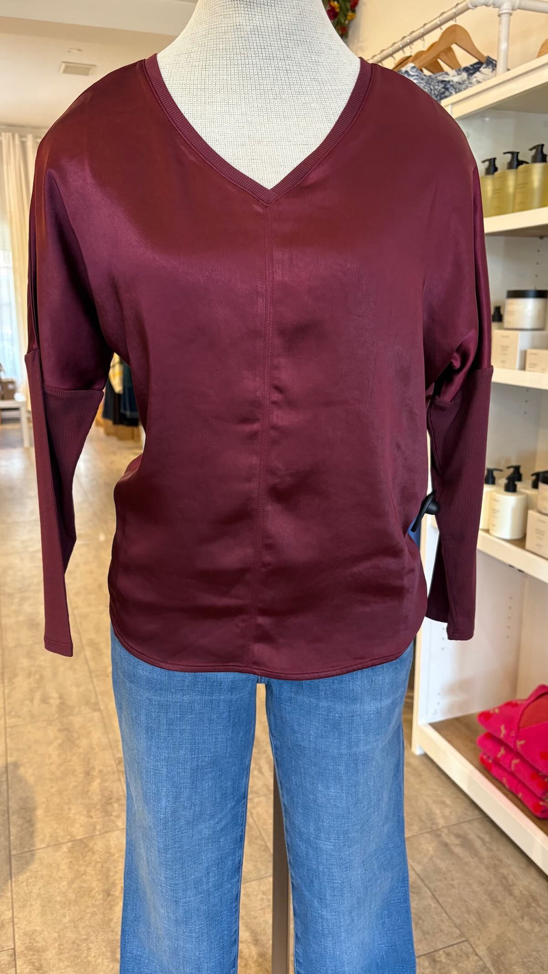 Cindy long-sleeve shirt by Melissa Nepton on a mannequin with blue jeans inside Lemonberry