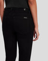 A closeup pic of the back pocket of the black skinnys by 7FAM.