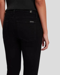 A closeup pic of the back pocket of the black skinnys by 7FAM.