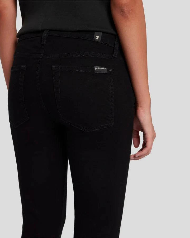 A closeup pic of the back pocket of the black skinnys by 7FAM.