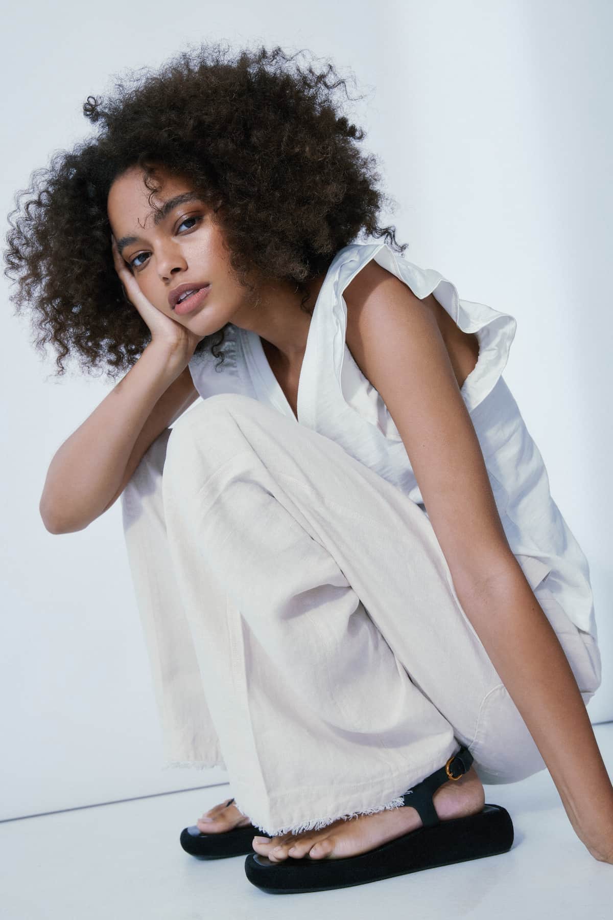 Relaxed V-neck flutter sleeve tee in off white cotton blend, Melissa Nepton, model view — Lemonberry Aurora