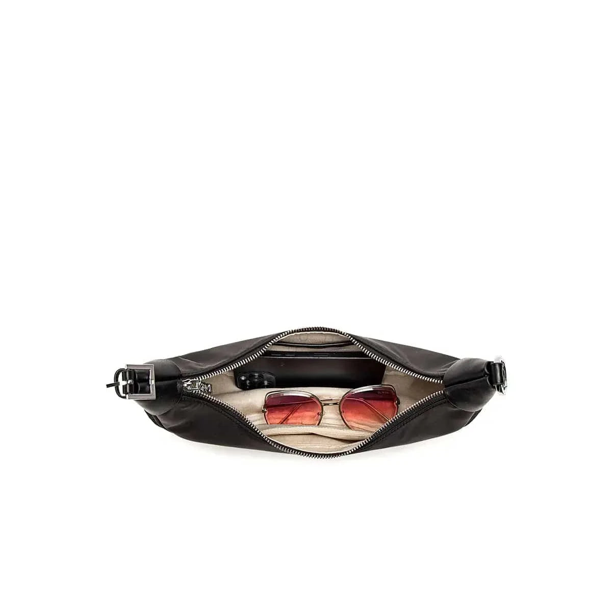 Crescent Bag filled with sunglasses and phone to show capacity.