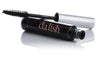 Open bottle of Dalish mascara resting on its container. 