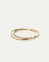Dane Bangle in gold finish shown closed on white — minimal and modern