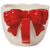 Close-up of sculpted red bow handle on Danica Bowtique Mug