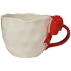Side angle of cream stoneware Bowtique Mug showing curved rim