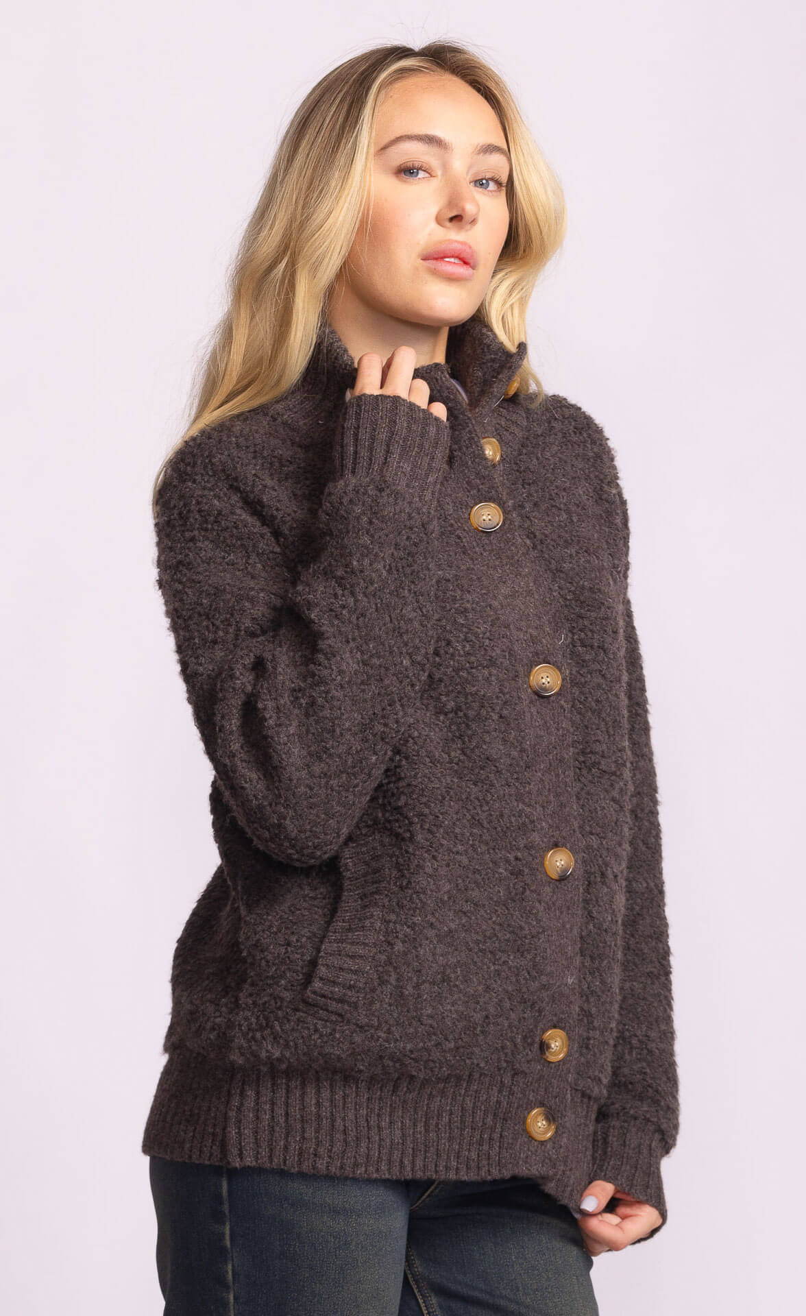Side view of Dolly Sweater showing textured knit and button details.