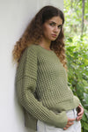 Thyme Sailing Sweater, back-angle lifestyle shot showing relaxed silhouette and ribbed hem.