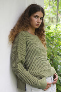 Thyme Sailing Sweater, back-angle lifestyle shot showing relaxed silhouette and ribbed hem.