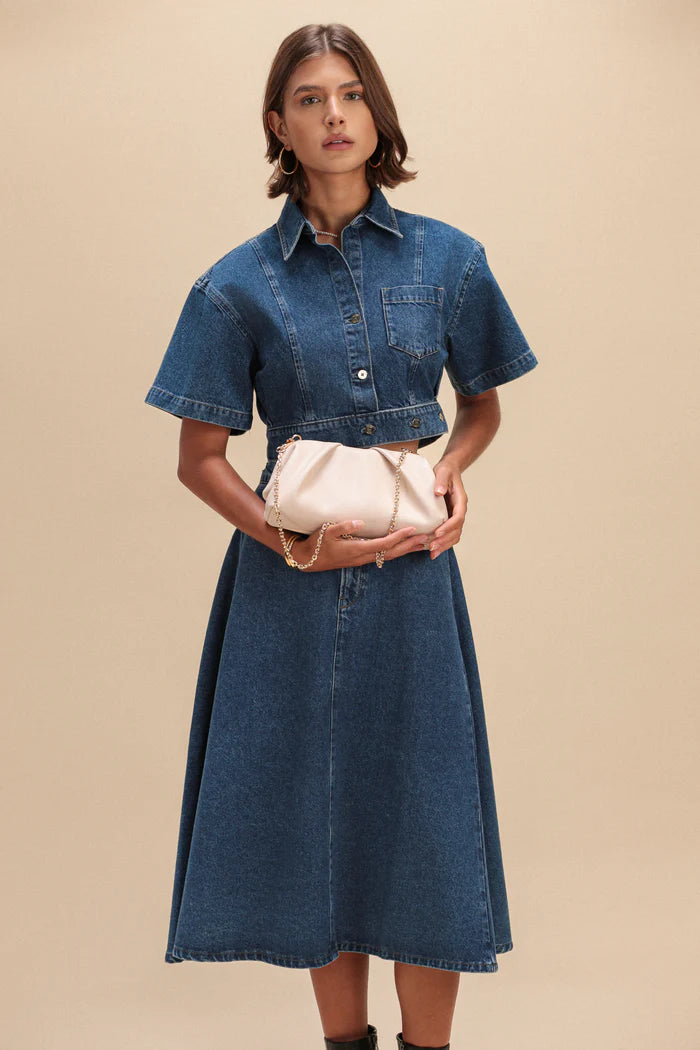 ELA frame clutch ecru vegan leather held as clutch on model Lemonberry Aurora