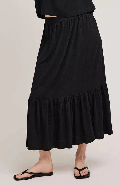 Front view of the  Elaine Skirt by Gentle Fawn, paired with black flip flops. Available at Lemonberry, a few minutes south of Bradford.