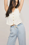Gentle Fawn Elio Pants – front view with arms raised, showing soft Tencel drape, Lemonberry Aurora.

