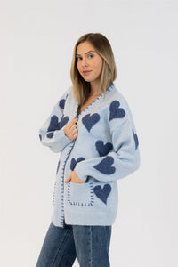Side angle showing front and pocket detailing on the cardigan