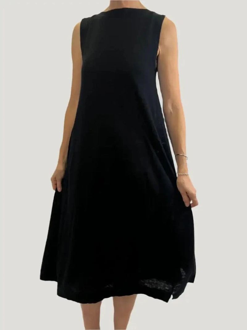 Model wearing the Erya dress by Naif at Lemonberry boutique in Aurora.