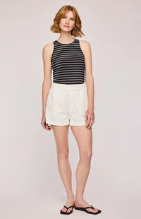 Another front view of the Eton Tank by Gentle Fawn, paired with white shorts and flip flips.