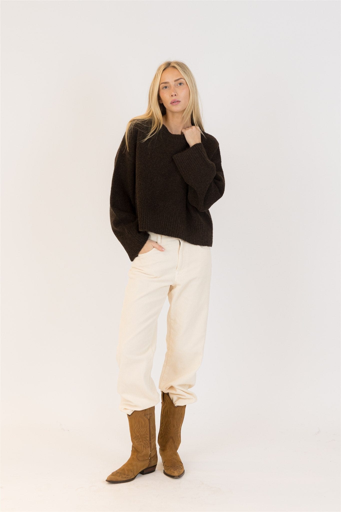Full body image of woman in chocolate EVA Luxe sweater by Lyla + Luxe, styled with off-white corduroy pants and tan Western boots against a white studio backdrop.

Let me know if you want filenames matched or a second variant set for A/B testing. Also ready when you are for the full SEO rundown!








Ask ChatGPT


