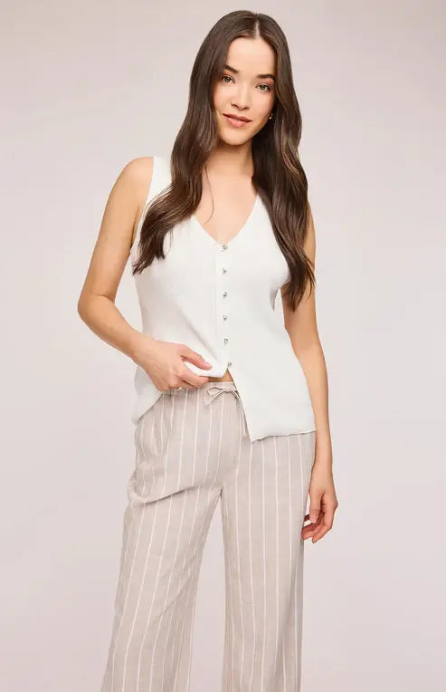 Close up of the Findley Pant by Gentle Fawn displaying the linen texture, pin stripe pattern and cute bow tie on the front.