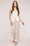 Model wearing the Findley linen pant by Gentle Fawn, paired with a cute white vest.