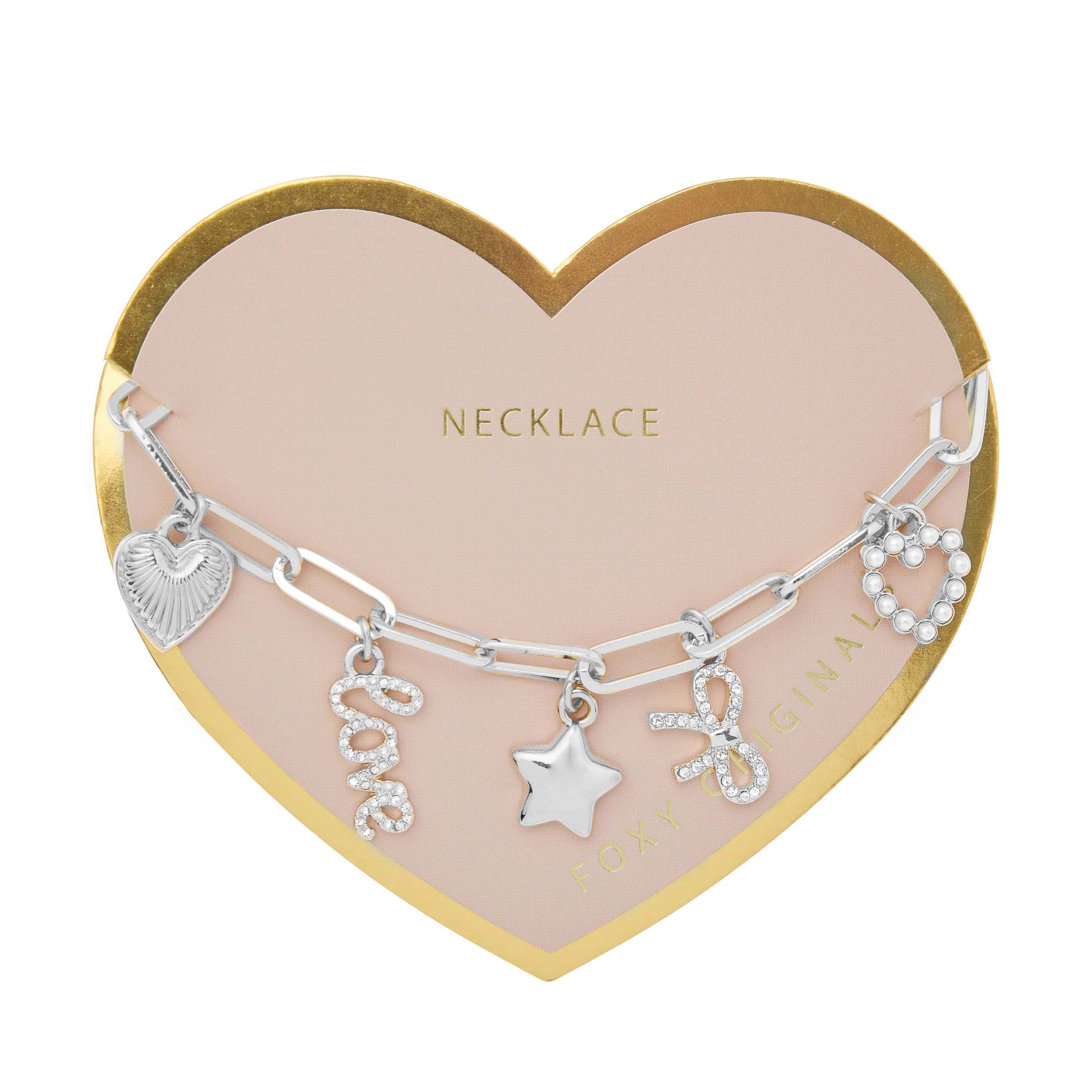Bella Charm Necklace by Foxy Originals in silver with heart, star, bow, pavé “love” and pearl charms – displayed on heart-shaped card
