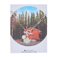 Maple Leaf Toggle Necklace in silver with pearl charm – displayed on card with forest cabin design by Foxy Originals