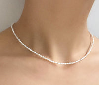 Petite pearl necklace worn on neck, Luna, worn view — Lemonberry Aurora